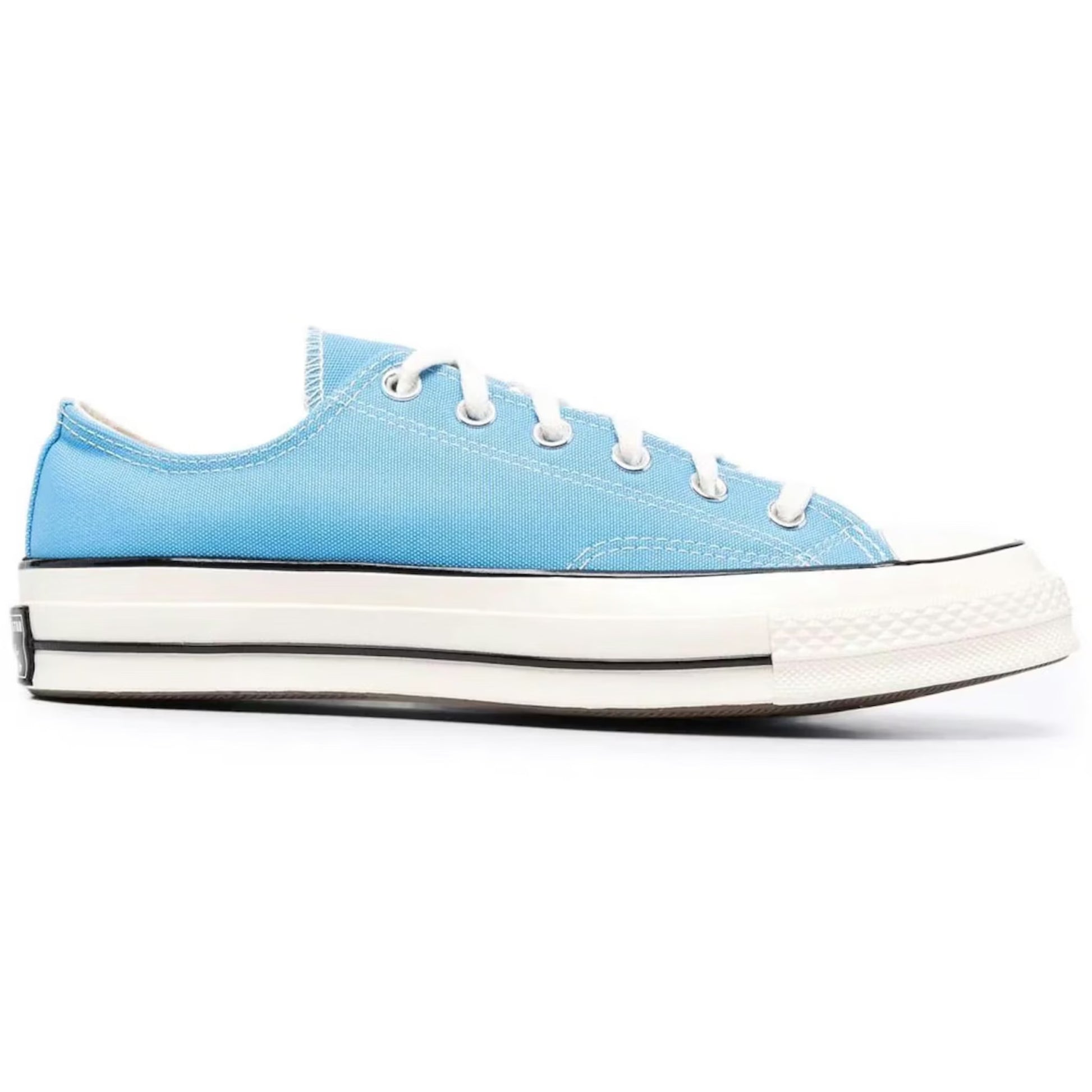 Blue sneaker with white laces and sole on a white background