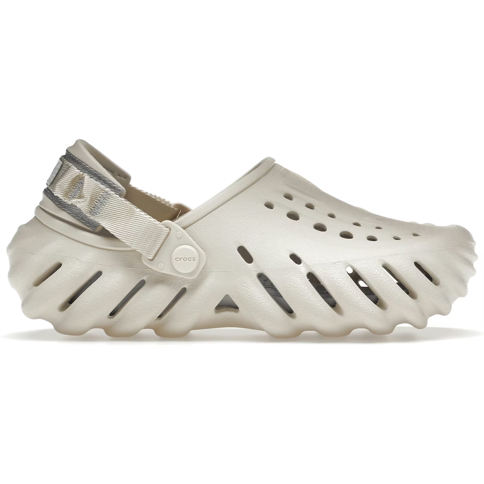 Beige clog shoe with a strap on a white background