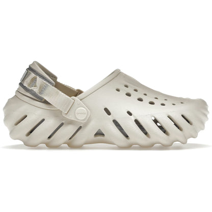 Beige clog shoe with a strap on a white background