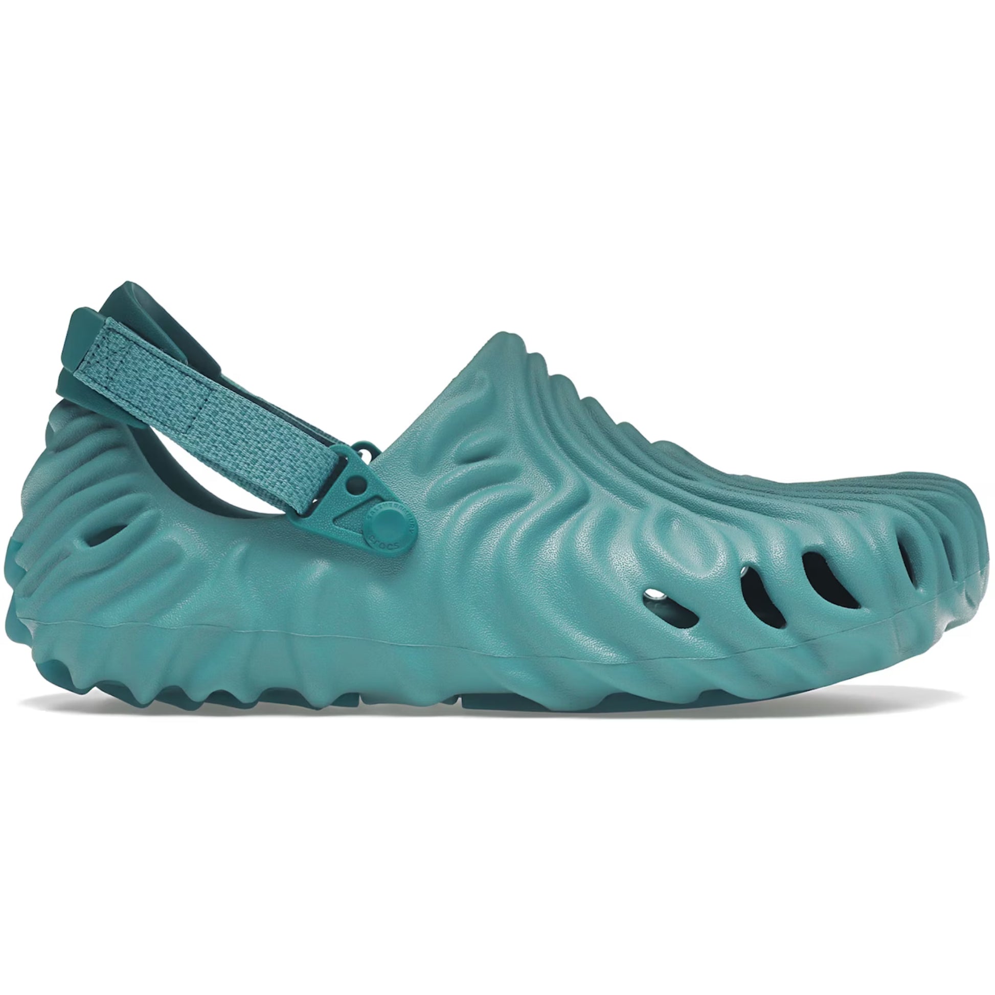 Teal shoe with a unique sole design on a white background