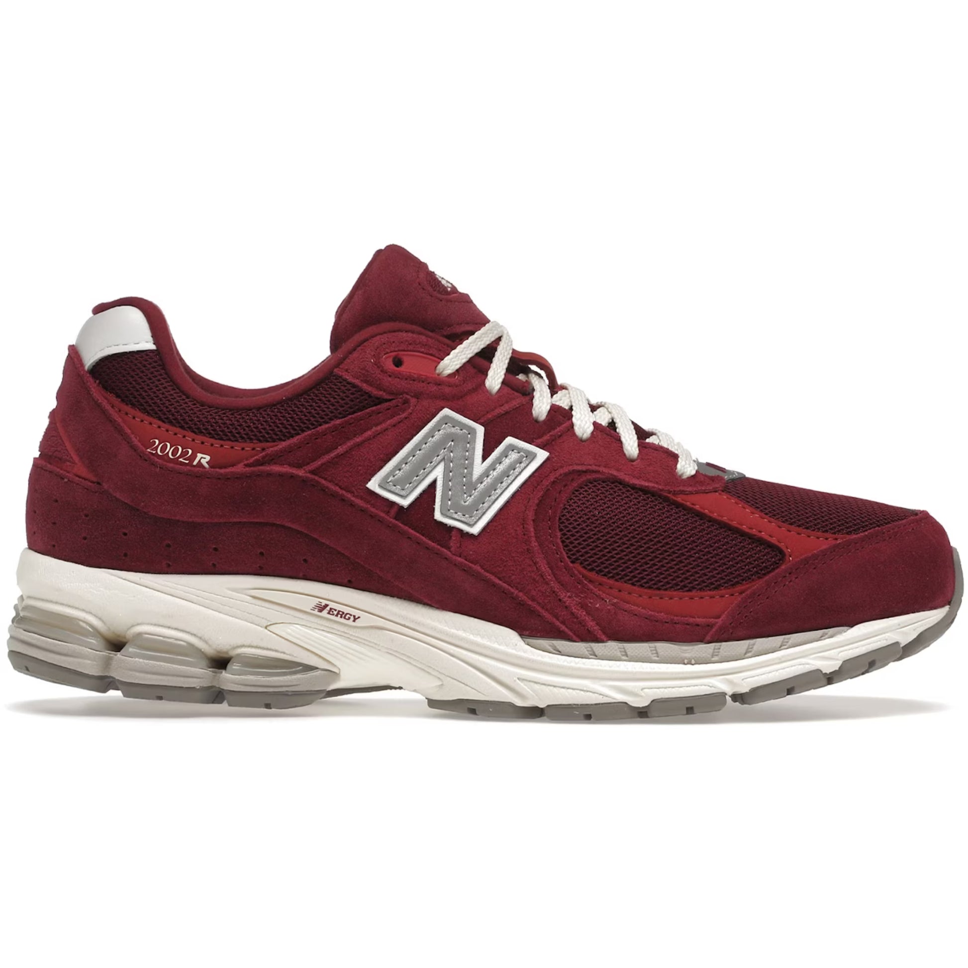 Red sneaker with a white sole on a white background