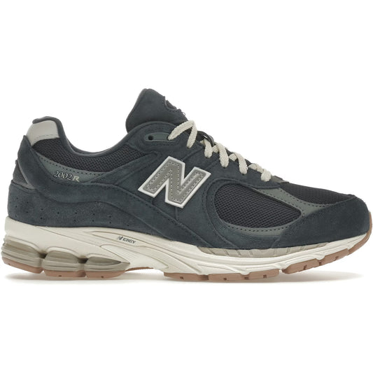 Gray and black sneaker with 'N' logo on a white background