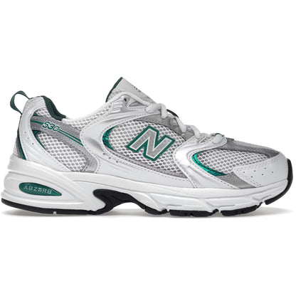 White running shoe with green accents on a white background