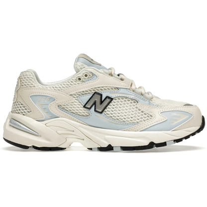 White sneaker with blue accents and New Balance logo on a white background