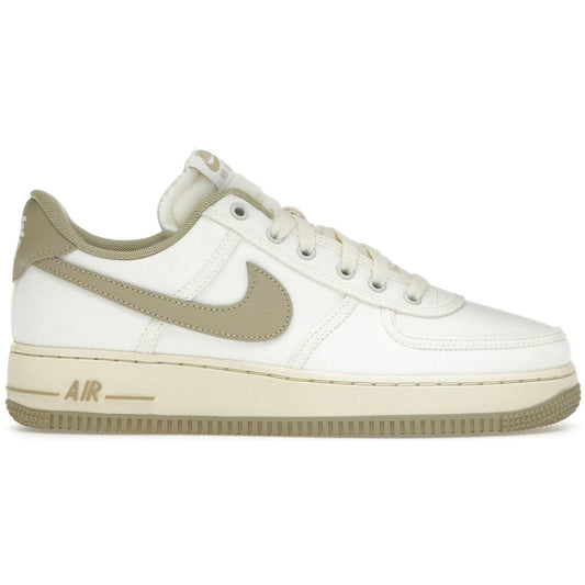 White sneaker with beige accents on a white background