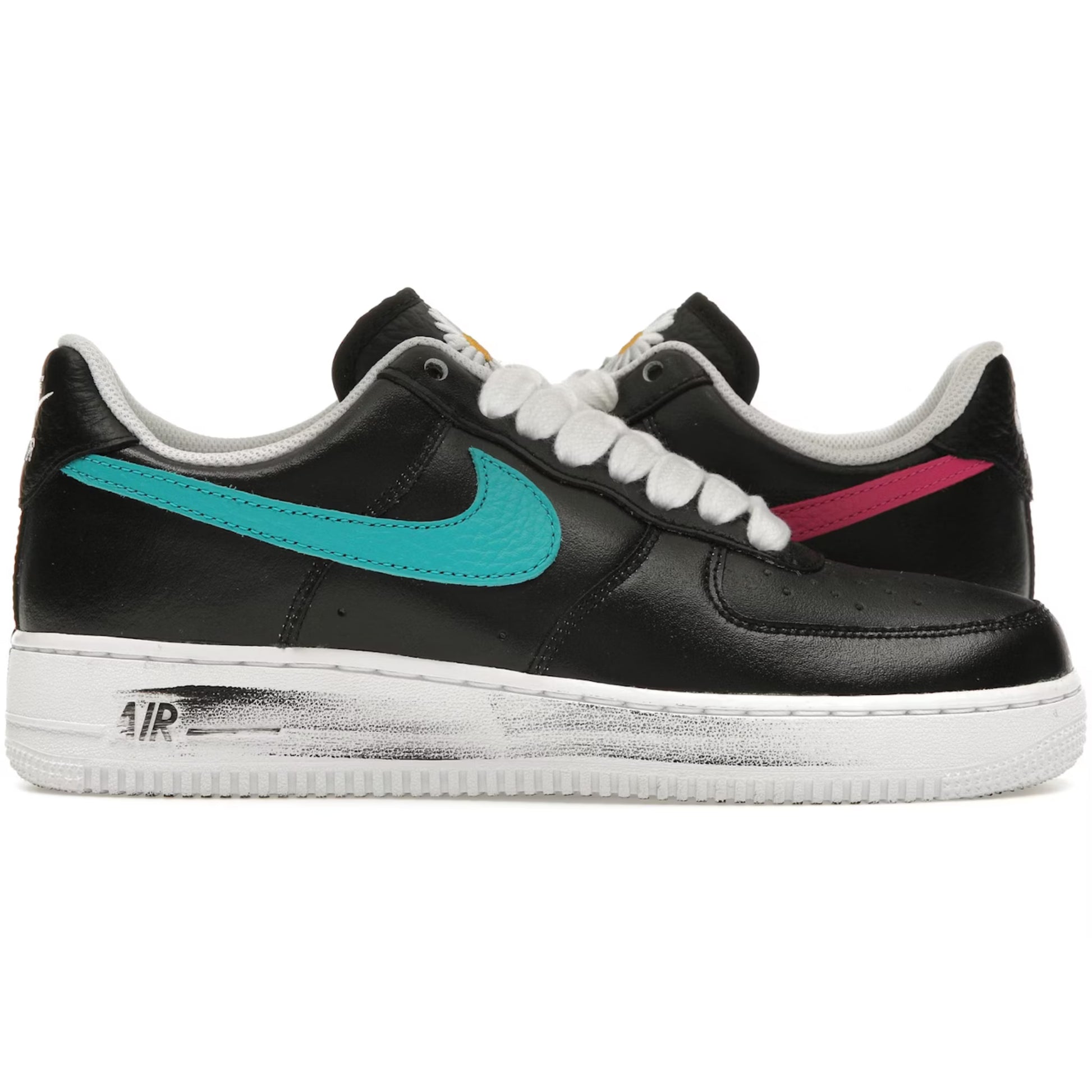 Black sneakers with colorful swooshes on a white background