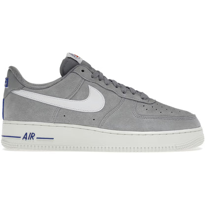 Gray sneaker with white swoosh logo on a white background
