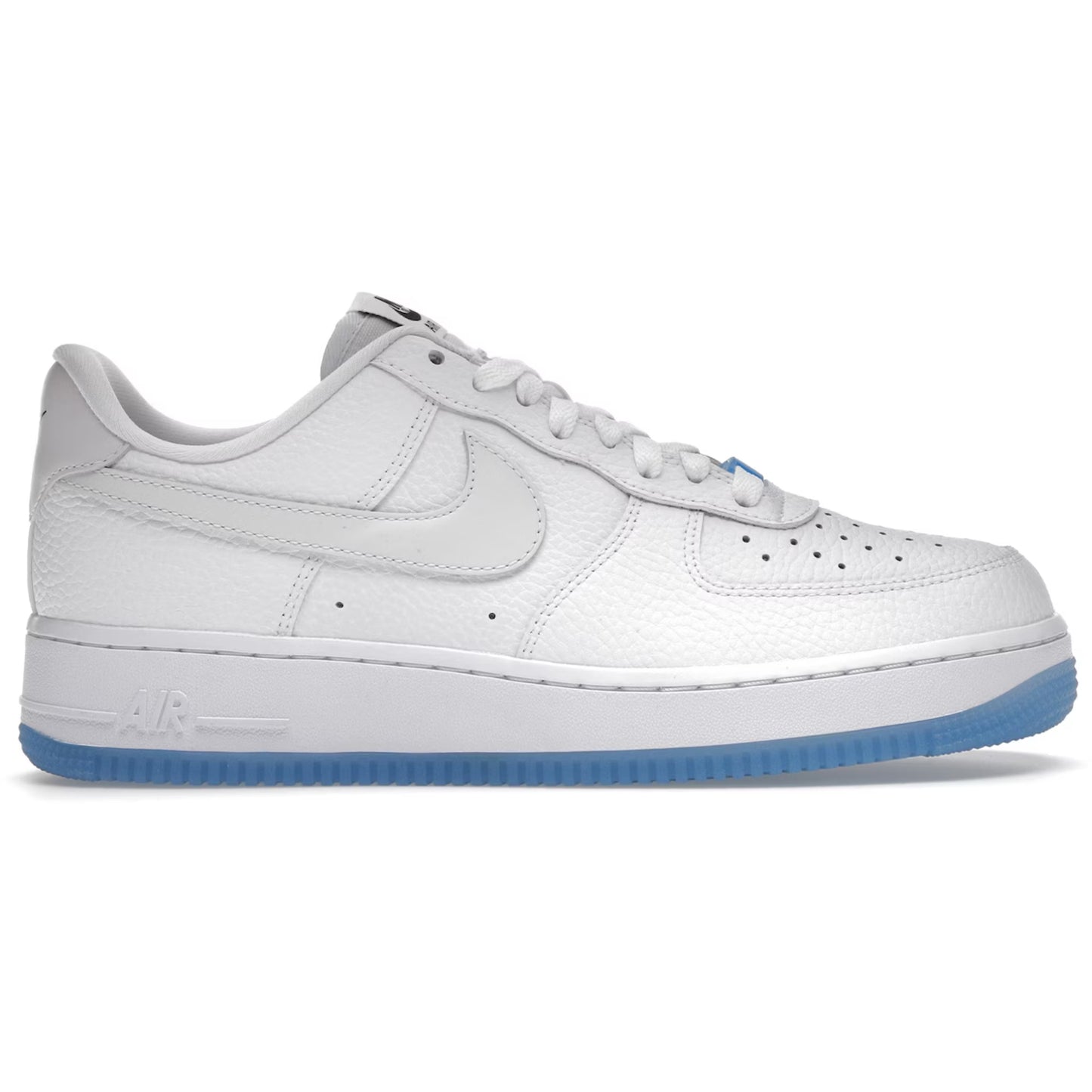 White sneaker with blue sole on a white background