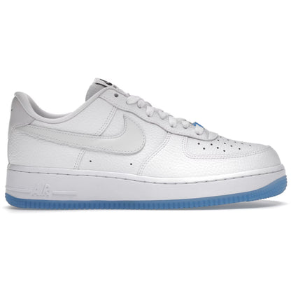 White sneaker with blue sole on a white background