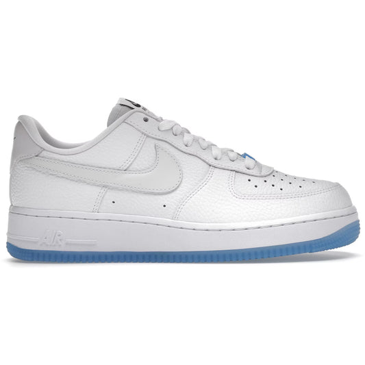 White sneaker with blue sole on a white background
