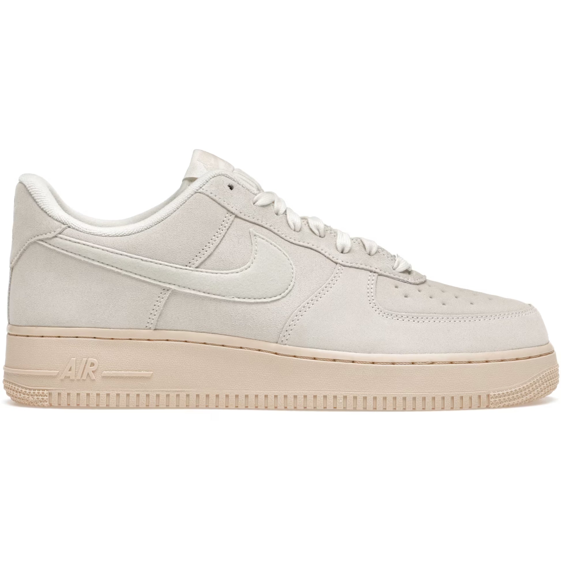 Beige sneaker with a visible Nike logo on a white background