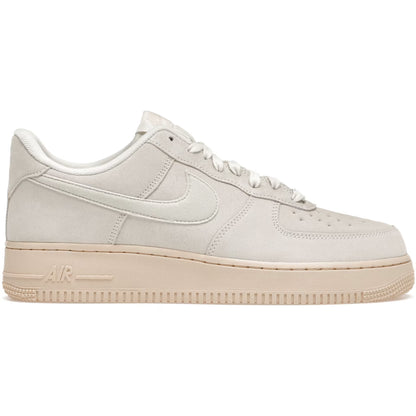 Beige sneaker with a visible Nike logo on a white background