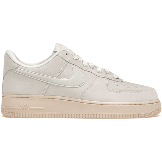 Beige sneaker with a visible Nike logo on a white background
