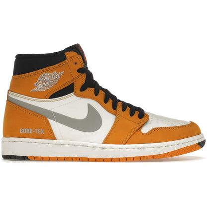 Orange and white sneaker with black accents on a white background