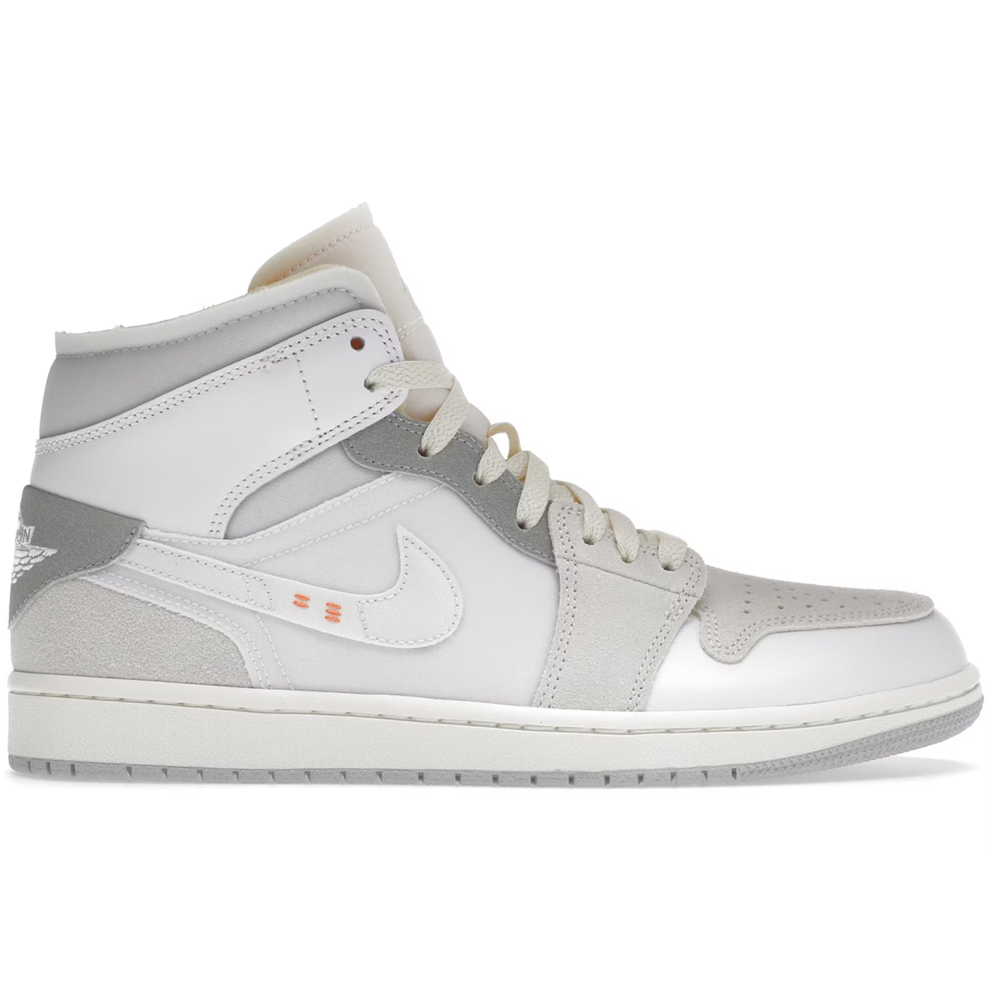 Gray and white sneaker with Nike logo on a white background