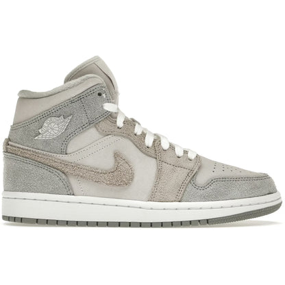Gray high-top sneaker with white swoosh logo on a white background