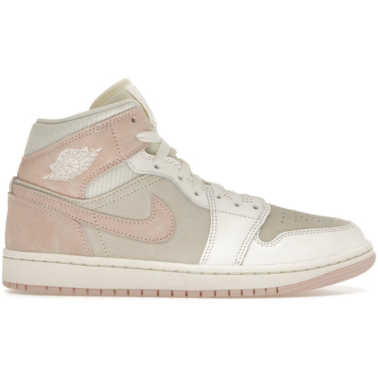 Pink and beige sneaker with Nike logo on a white background
