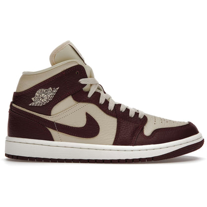 Brown and beige high-top sneaker with Nike logo on a white background