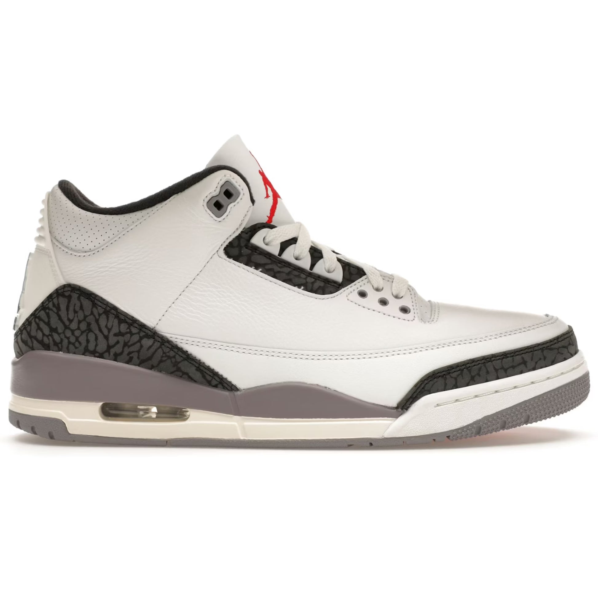 White sneaker with black and gray accents on a white background