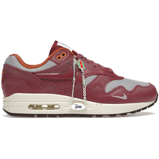 Maroon sneaker with white sole on a white background