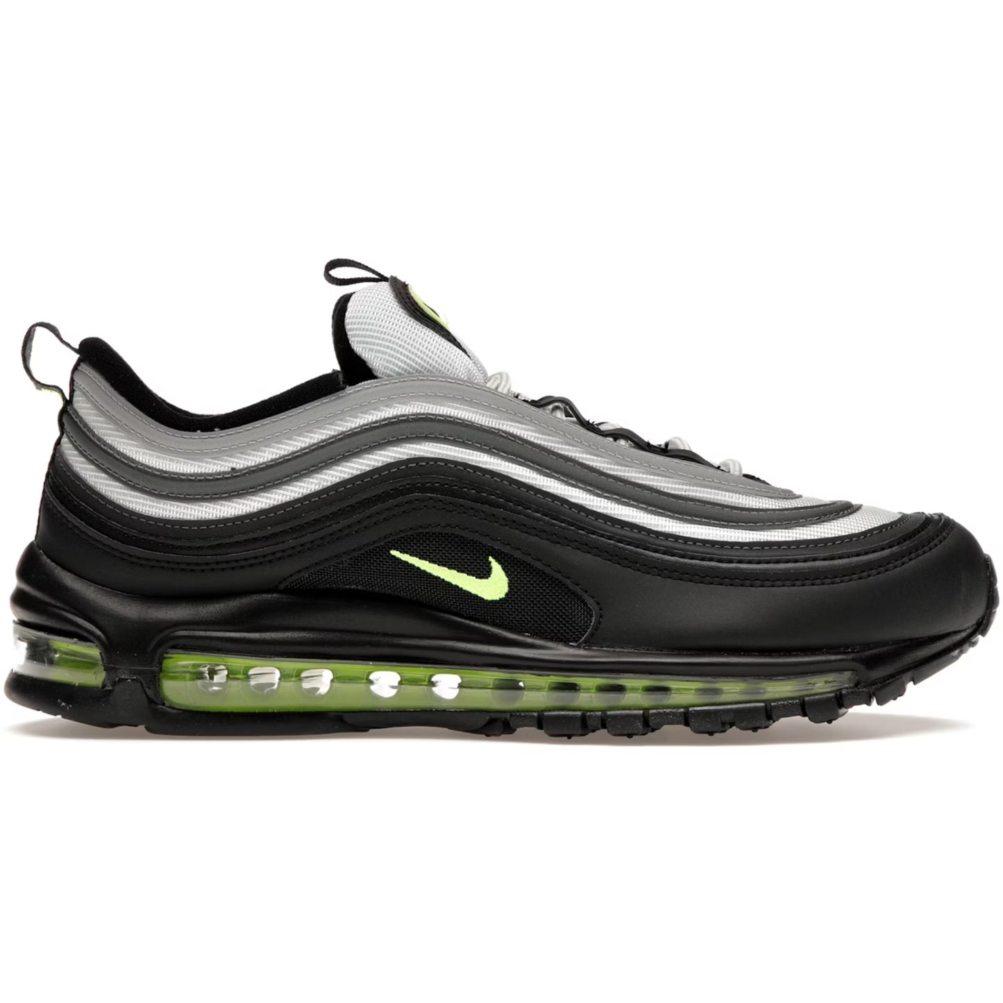 Black and gray sneaker with green sole on a white background
