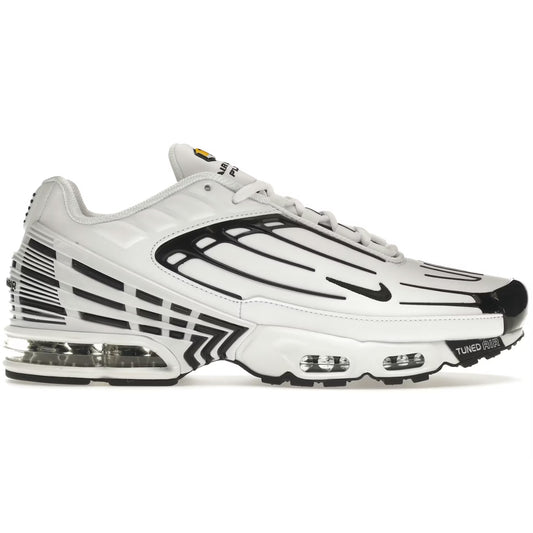 White and black sneaker with visible branding on a white background