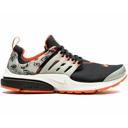 Black and orange sneaker with unique pattern on a white background
