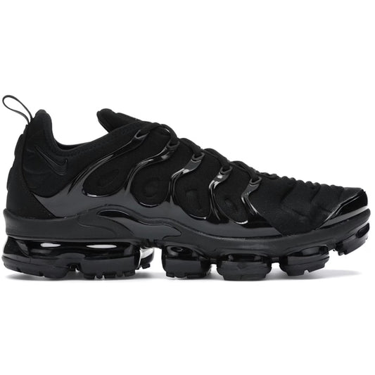 Gray and black sneaker with a green Nike logo on a white background