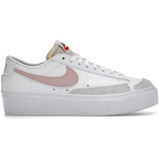White sneaker with pink swoosh logo on a white background