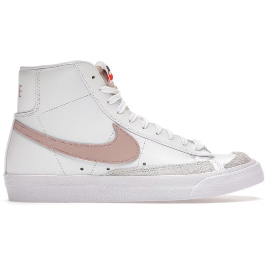 White sneaker with a pink swoosh logo on a white background