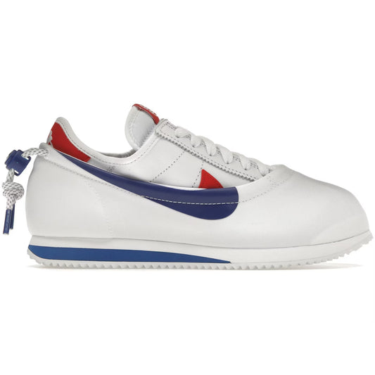 White sneaker with blue and red accents on a white background