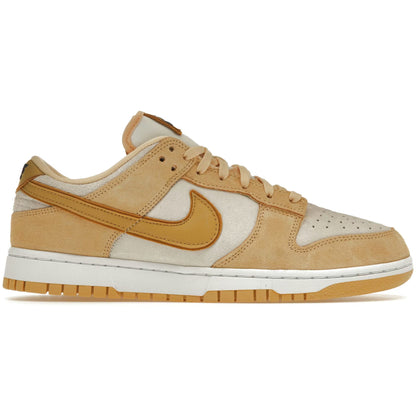 Beige and white sneaker with a prominent Nike logo on a white background