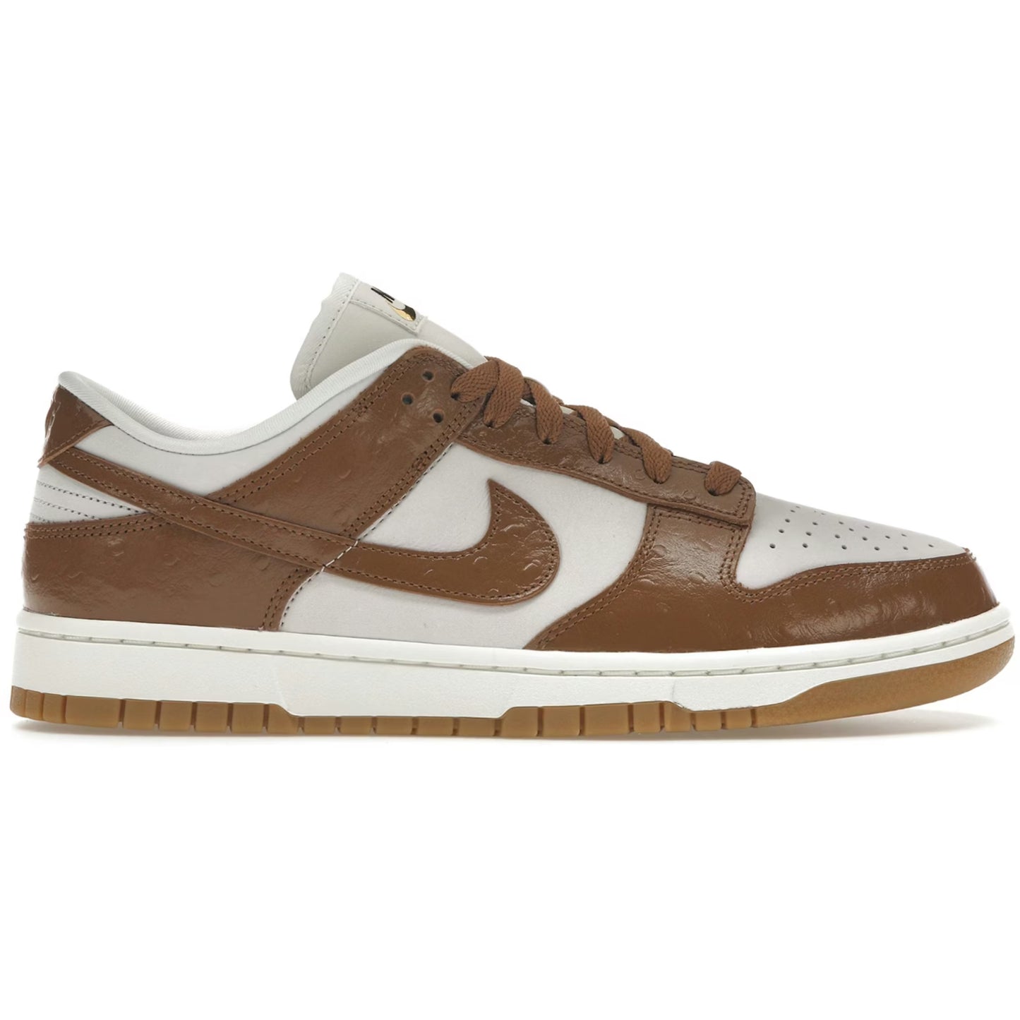 Brown and white sneaker with Nike logo on a white background