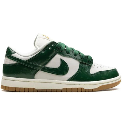 Green and white sneaker with a brown sole on a white background