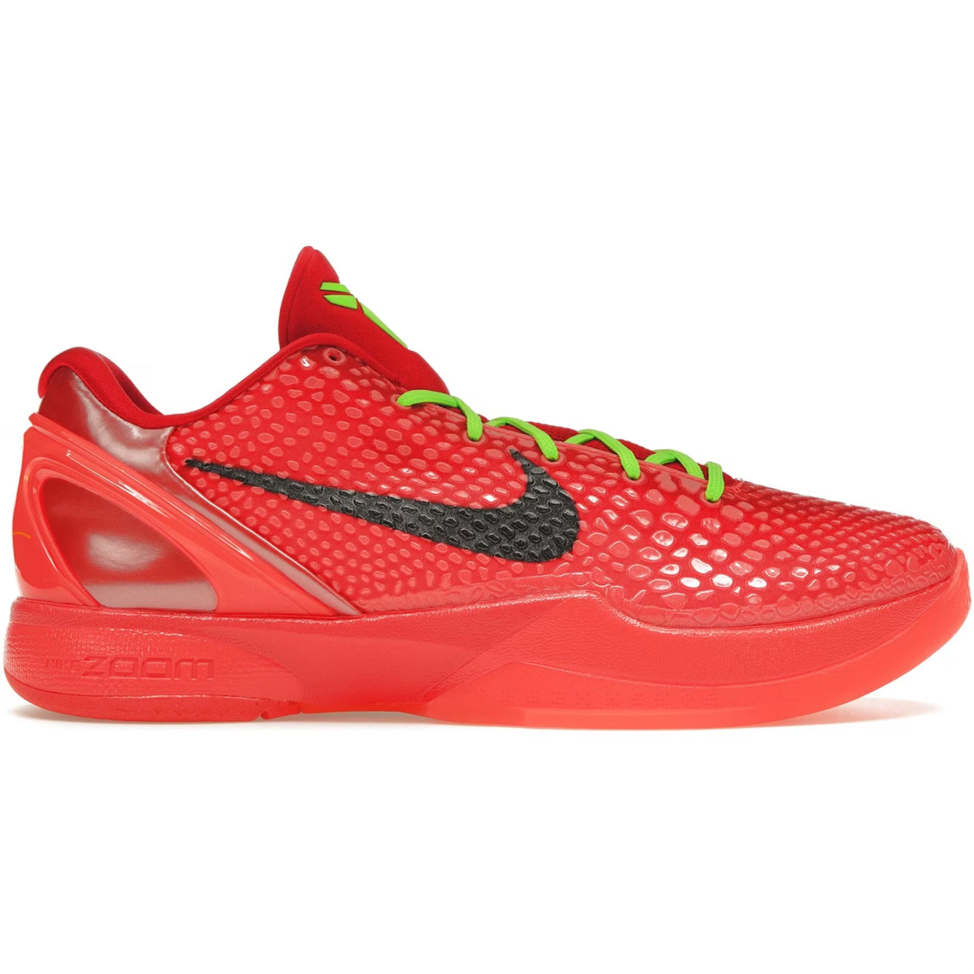 Red sneaker with green laces and black Nike logo on a white background