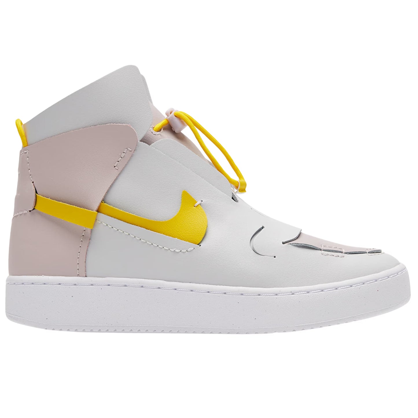 White sneaker with yellow accents on a white background