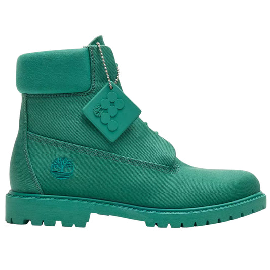 Green boot with a brand tag on a white background