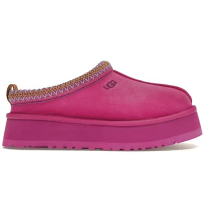 Pink slipper with decorative trim on a white background
