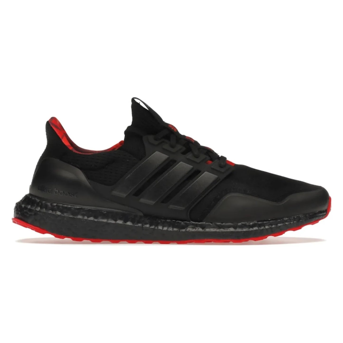 Black running shoe with red accents on a white background